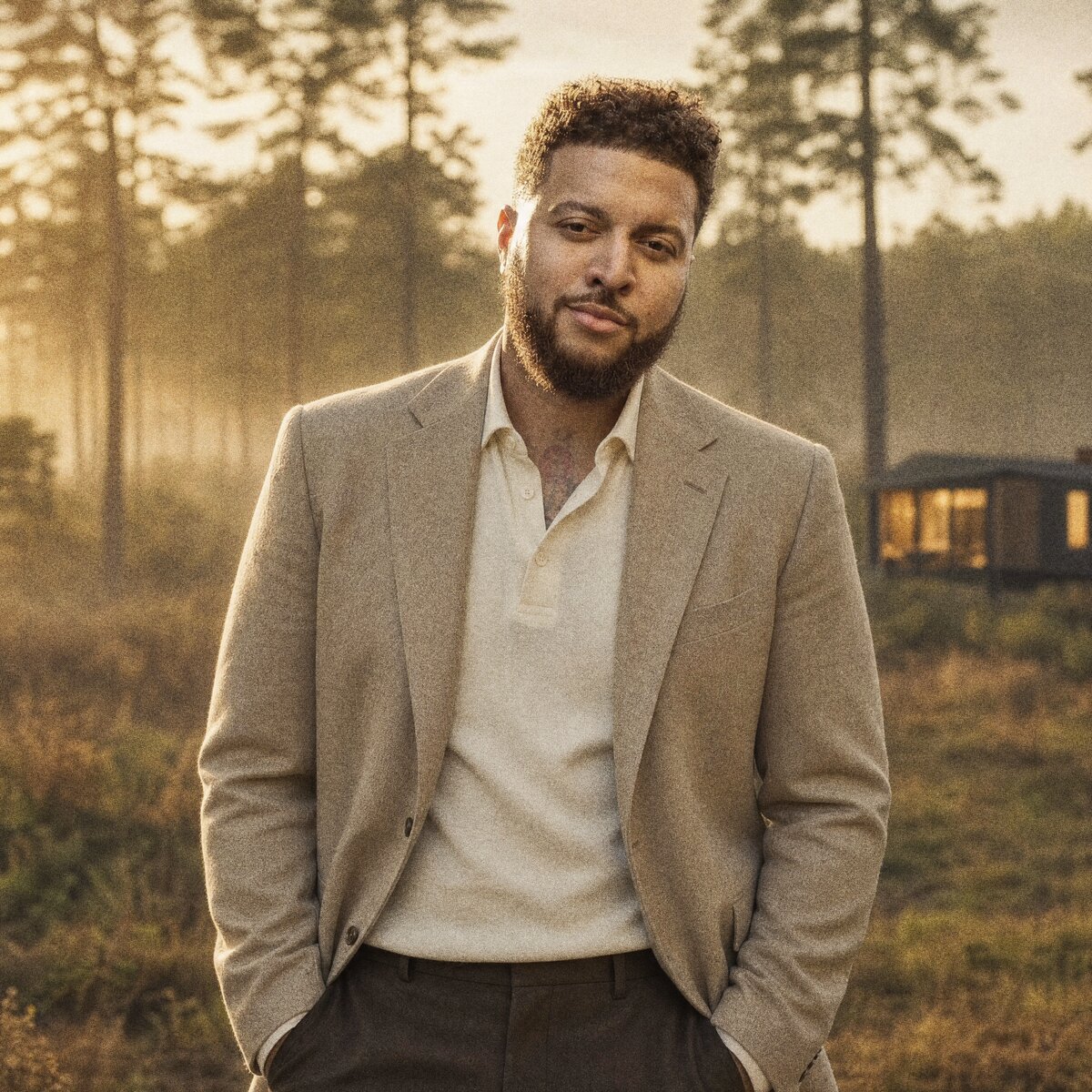 Cameron Jo'van, founder of PERCH, standing in a Georgia pine stand at golden hour